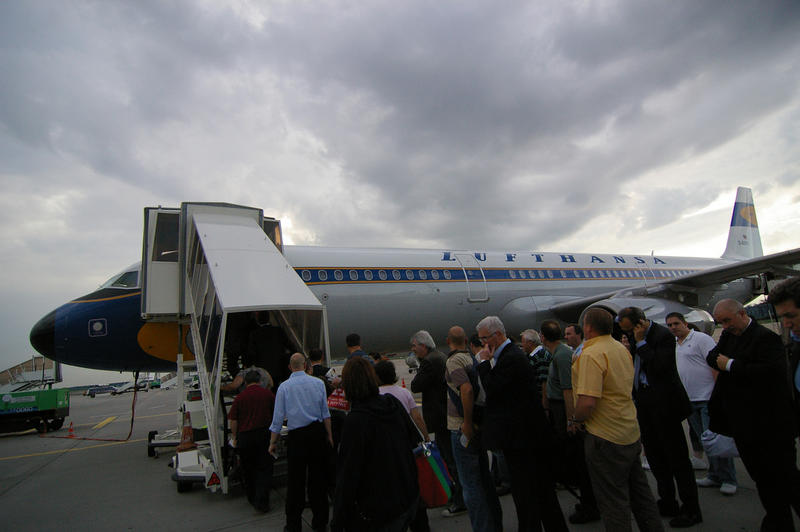 editorial use only : a queue of passengers boarding a scheduled flight