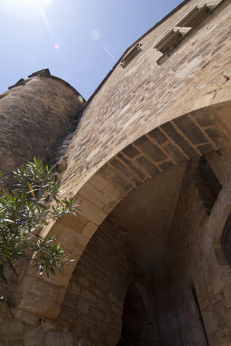 a stone arch entrance to an old french building