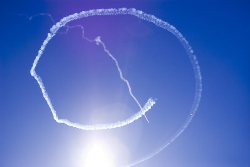 circular smoke trails at an air show