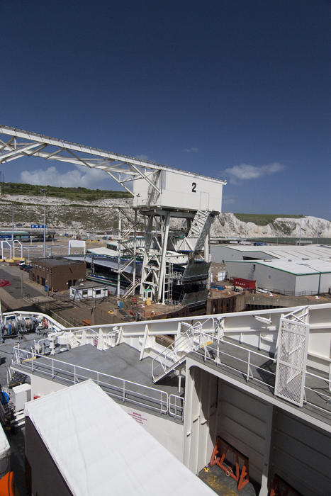 the ferry terminal at dover, england, and the landmark white cliffs to the rear