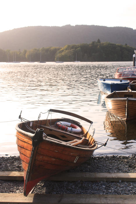 <p>Row Boat on the banks of Lake Windermere in the Lake District in Cumbria, UK</p>