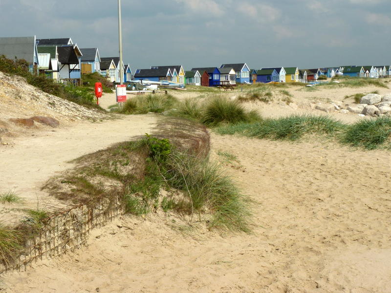 <p>Beach huts on Mudeford Spit at Hengisbury Head.jpg.</p>