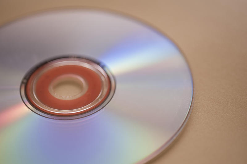 an audio compact disc pictured with an narrow depth of field to create a background with plenty of space for text