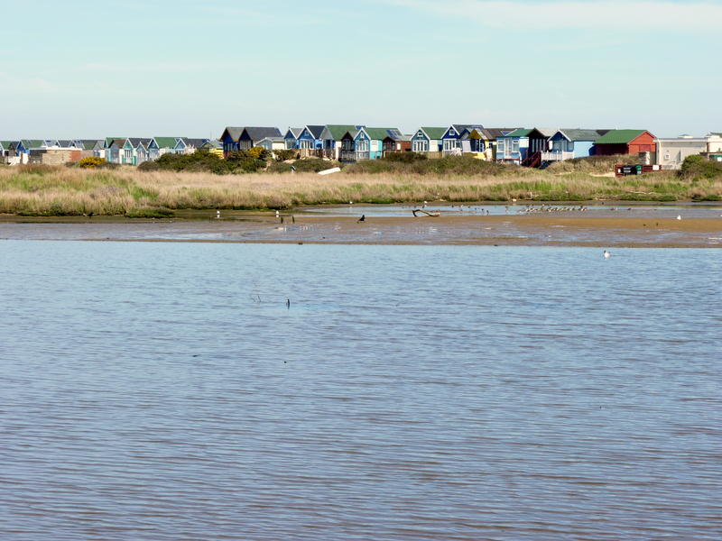 <p> Colourful beach huts at Christchurch Harbour</p>