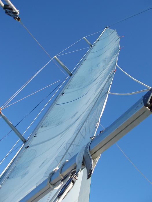 looking up the sail of a rigged sailing yacht with sail