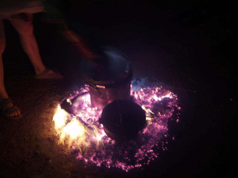 campfire cooking pots boiling on top of hot embers