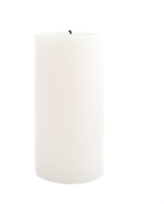 a large pillar candle isolated on a white backdrop