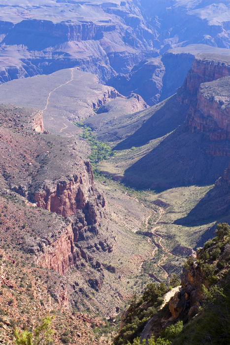 eroded dry river bed seen looking down into the grand canyon