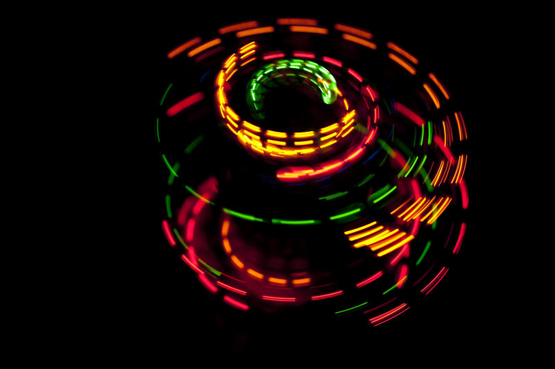multi-colored flashes of light plotting a circular path