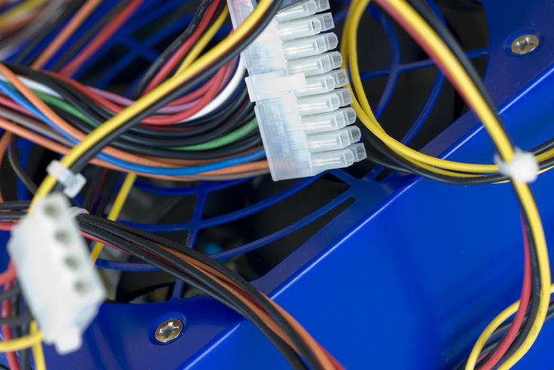 a tangle of power cables from inside a computer case