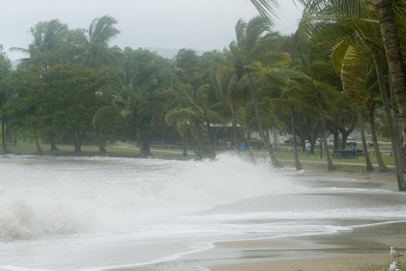strong winds blowing waves onto a tropical beach