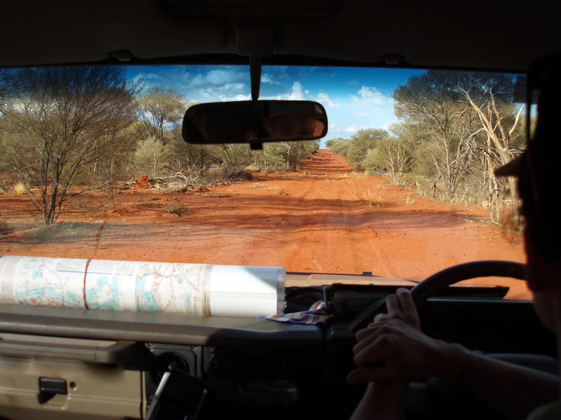 driving along a red dirt road in australias northern territory
