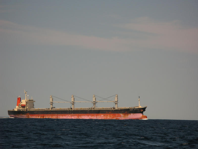 a large unladen bulk freight carrier in the open ocean