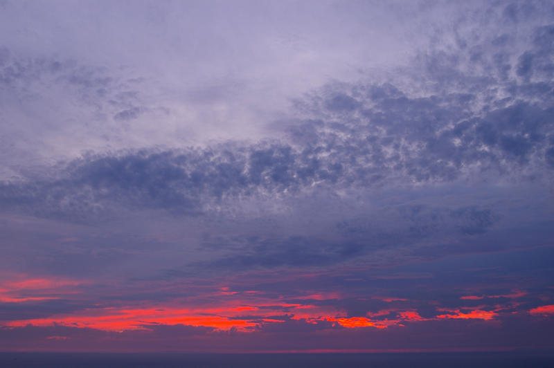 dusk sky glowing bright red as the sun sets