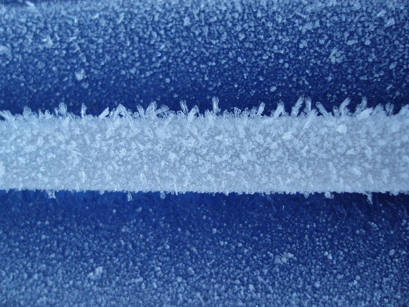 macro image of a car covered in frost
