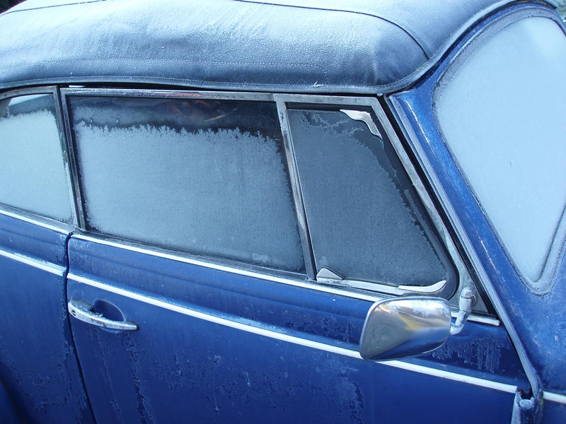 a classic car covered in frost and ice