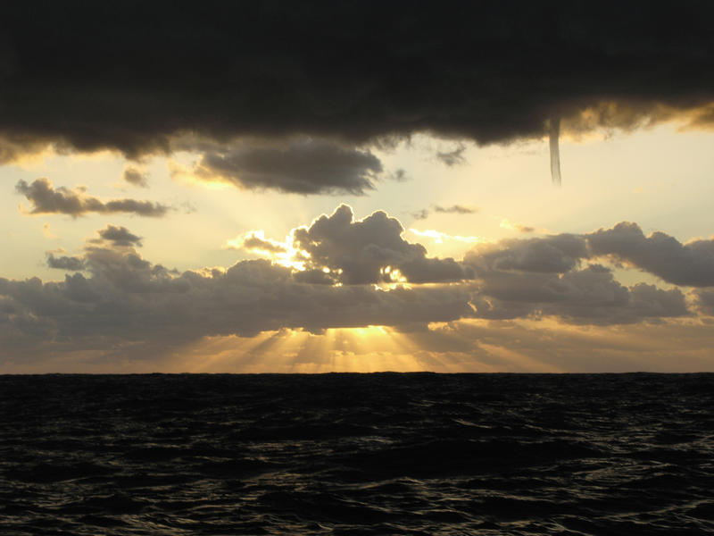 A cold air funnel cloud, is like a small tornado but it does not contact the ground or ocean