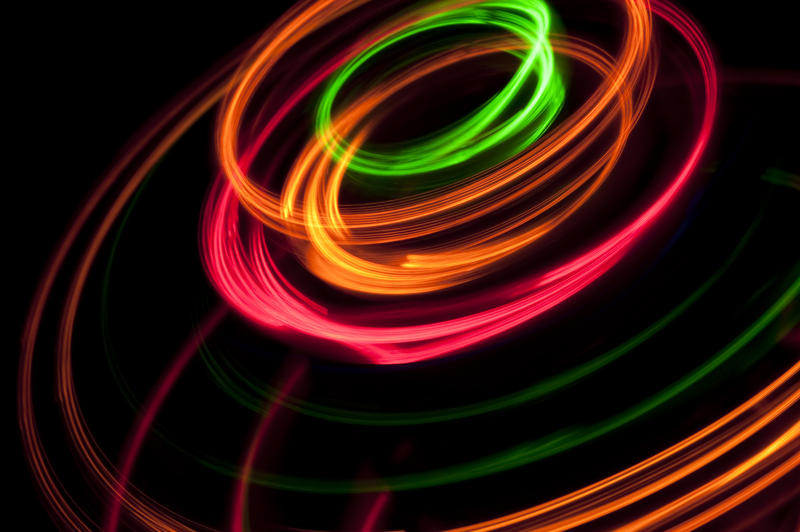 a round twisting pattern of brilliantly glowing coloured lines