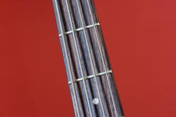 4008-guitar strings on red