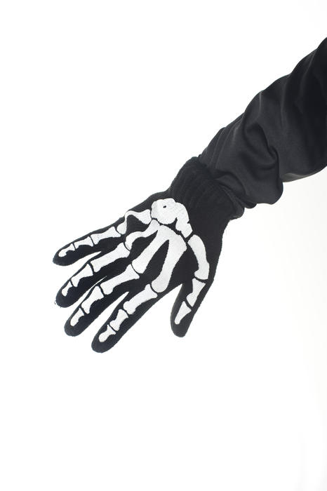 a novelty halloween glove with skeleton bones printed on it