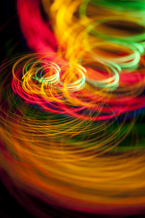 spinning and roating glowing lines of dazzling colour