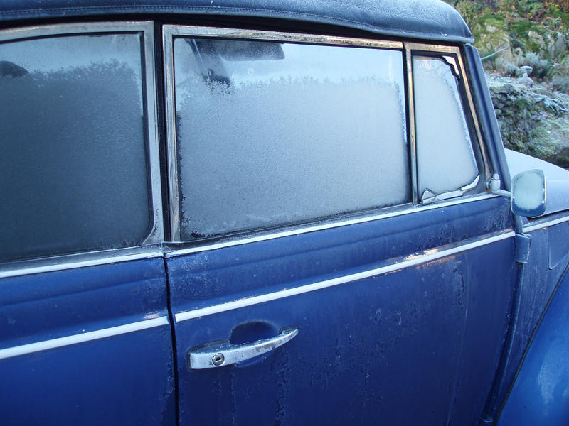 a frozen car in need of deicing