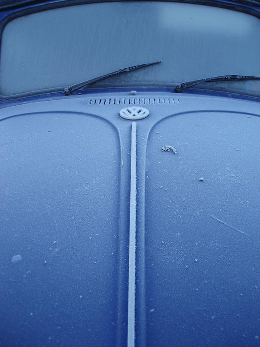 a car covered in rime frost on a cold winter day