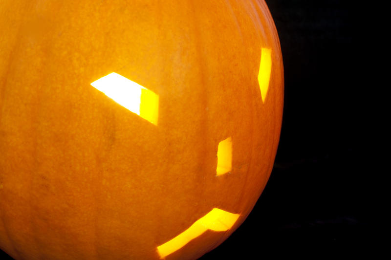 a scary looking halloween pumpkin face