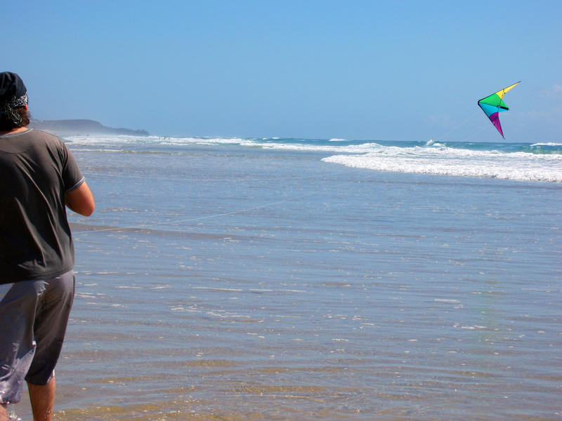 flying a kite on the beach