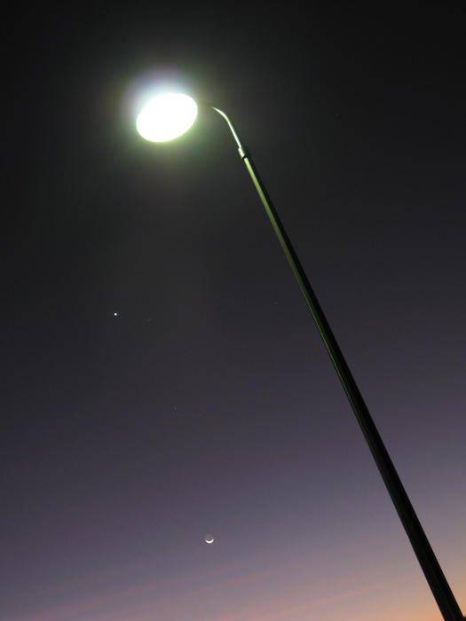 an illuminated streetlight at night