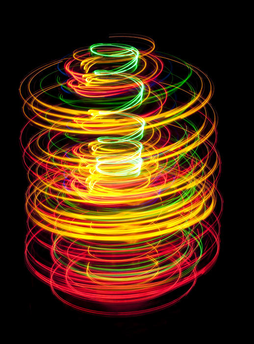 concentric helixes creating a corkscrew effect abstract light pattern