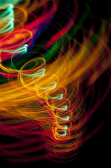 spiraling lines of light creating a tornado or whirlpool type effect
