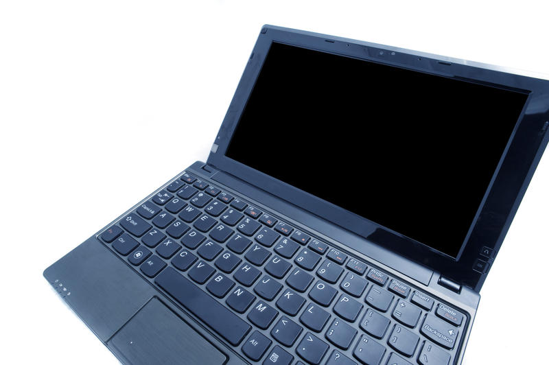 a black coloured netbook computer pictured with a wide angle lens