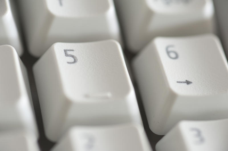 number keys on a beige computer keyboard