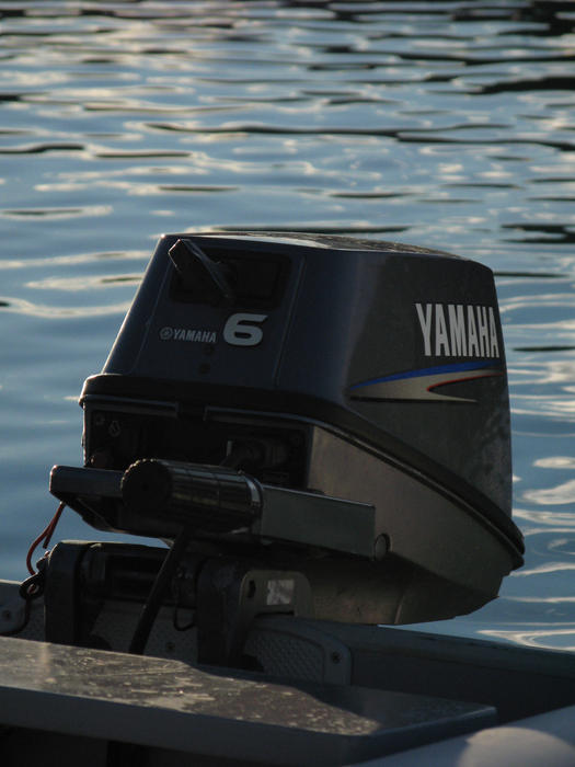 editorial use: small outboor engine on the back of a tender boat