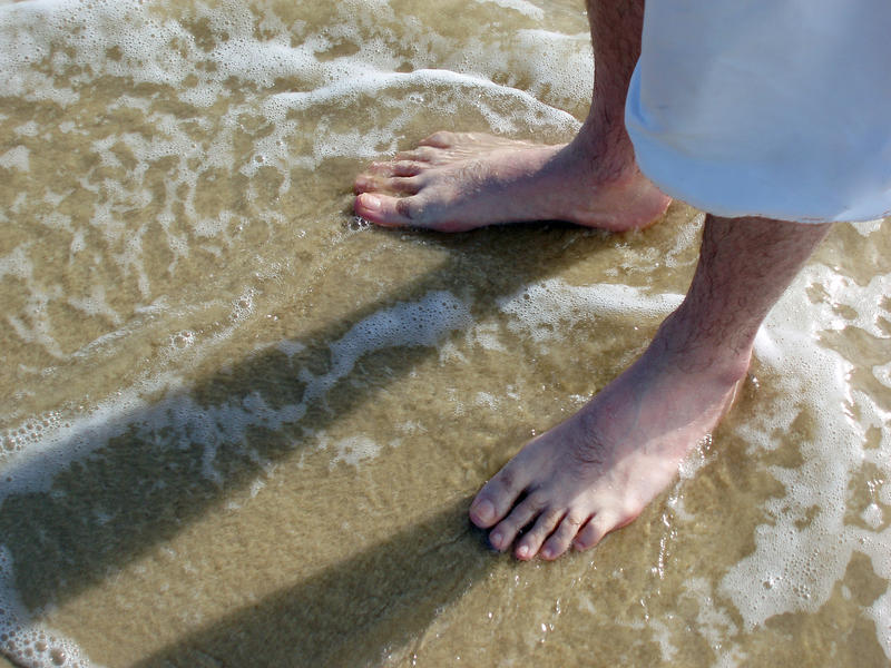 enjoying the warm shallow  water paddling in breakers