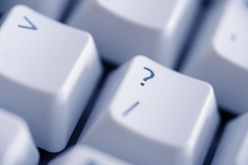 close up on the question key on a computer keyboard.