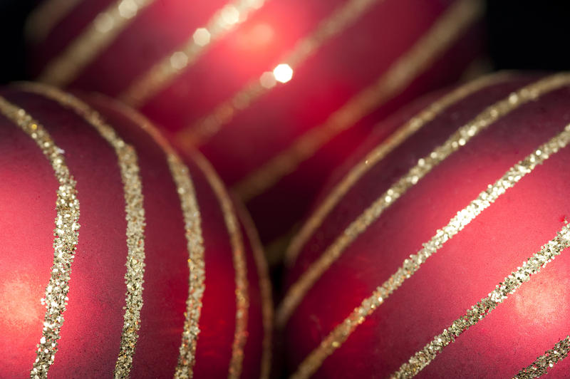 red christmas baubles on a low key dark background