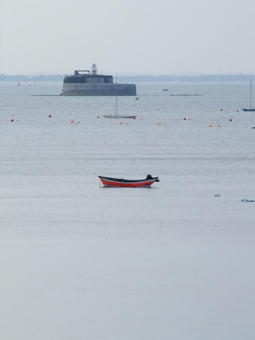 <p>Spitbank Fort and red boat from Bembridge, Isle of Wight&nbsp;</p>