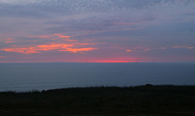 sky glowing red with the last light of the day