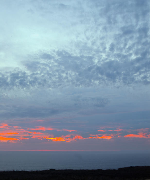 dusk sky glowing red with a fiery sunset