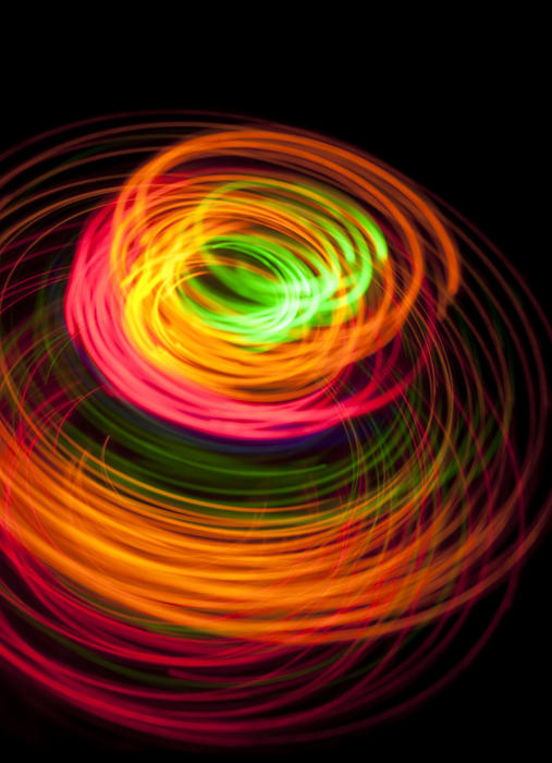 a stylish colorful background image of brighty colored light trails