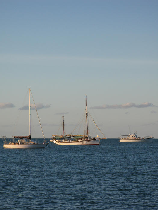 a ketch rigged sail boat on the water