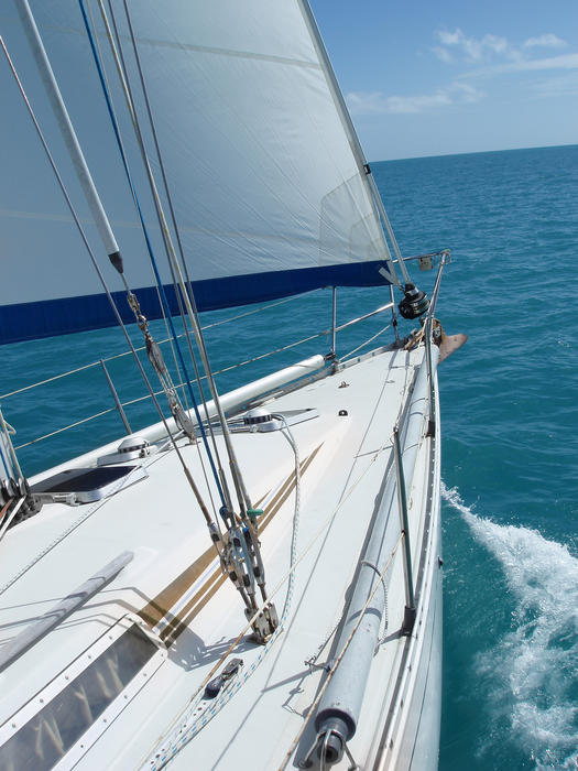 the bow of a yacht sailing through the water