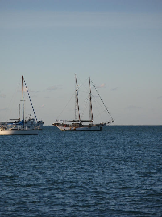 a schooner rigged sail boat on the water