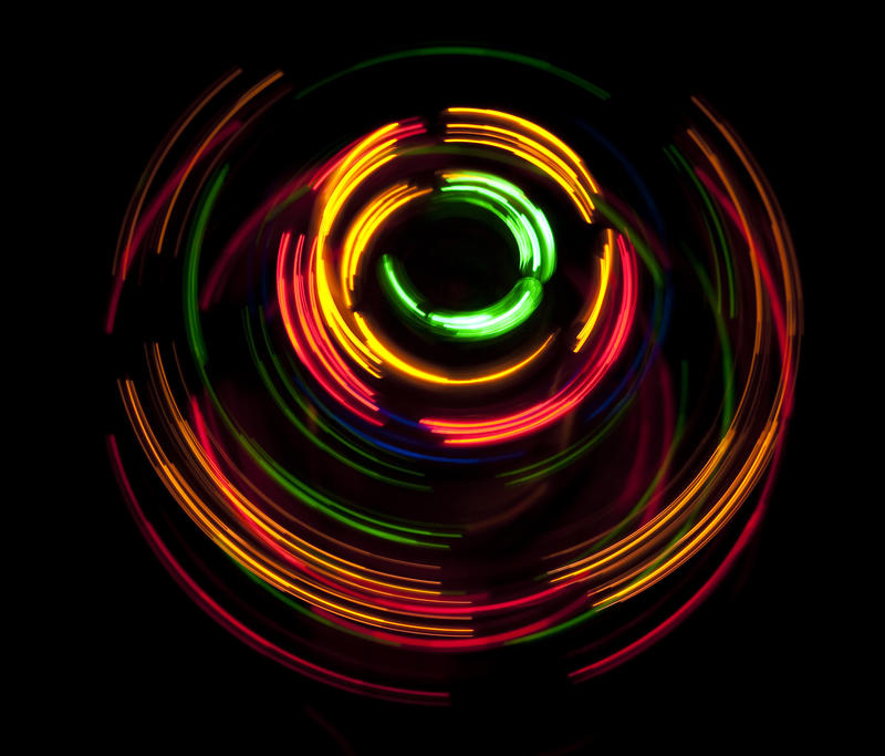 coloured light twisting against a black background