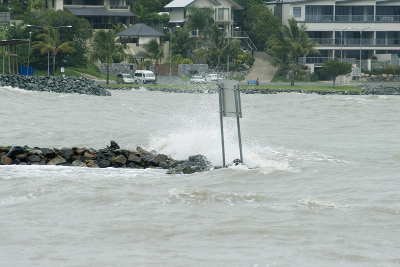 high tide blown onto land by a storm increasing the hight of the tide and causing flooding to low lying areas