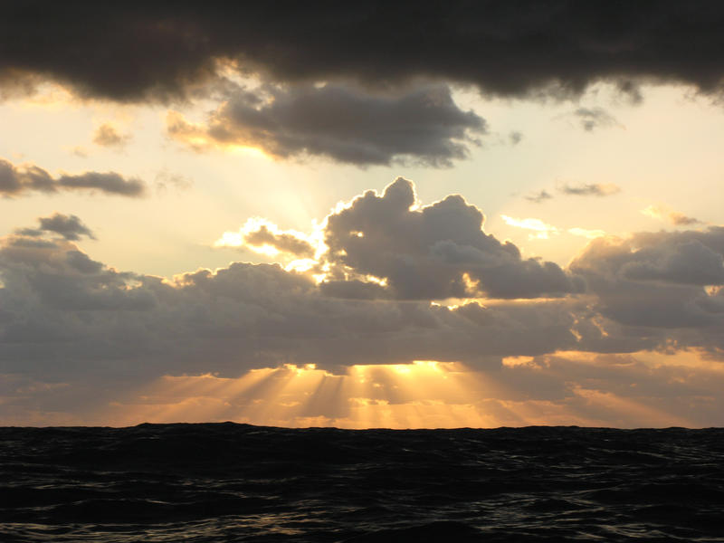 sunlight streams from behind a cloud