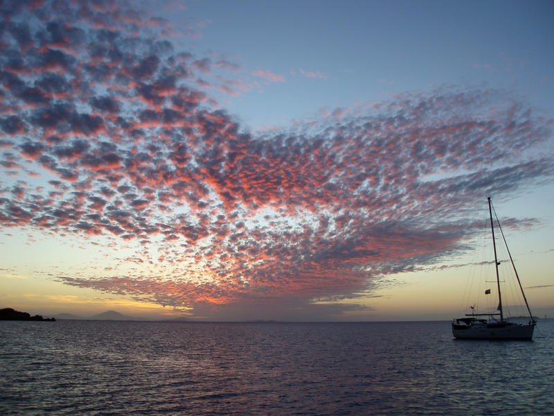 silhouette of a yacht at sunset