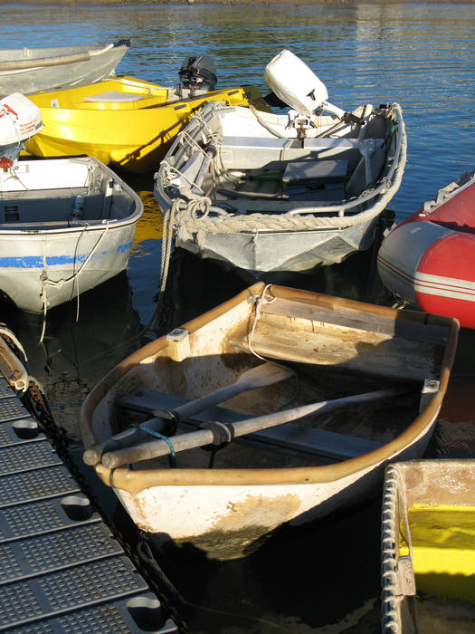 tenders tied up at a jetty